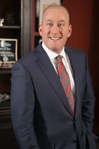 David Meyer poses for photo in office