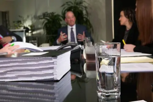 Glass of water on table in Meyer Wilson Werning conference room.