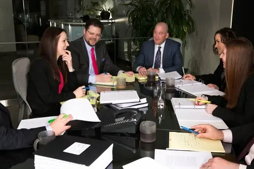 Meyer Wilson Werning staff gathered around a conference table