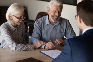 a mature couple consulting with a churning lawyer in Arizona
