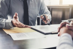 Lawyer meets with client to explain whether they can file a lawsuit against Binance.