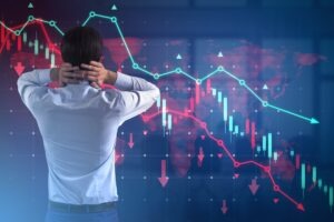 Person standing in front of a graph with multiple lines and arrows on it that are pointing down and wondering if they can recover losses from a margin liquidation